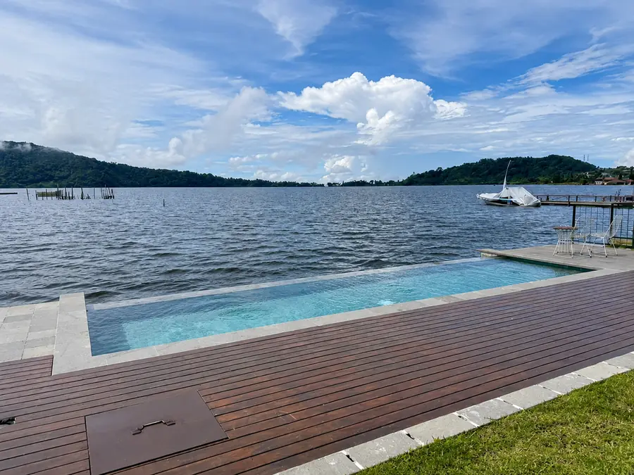 Lakeside pool and timber deck beside the calm water of Lake Buyan.